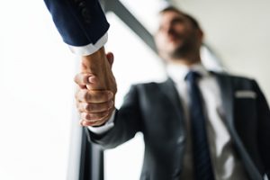Designed by rawpixel.com / Freepik - image of a person shaking another persons hand